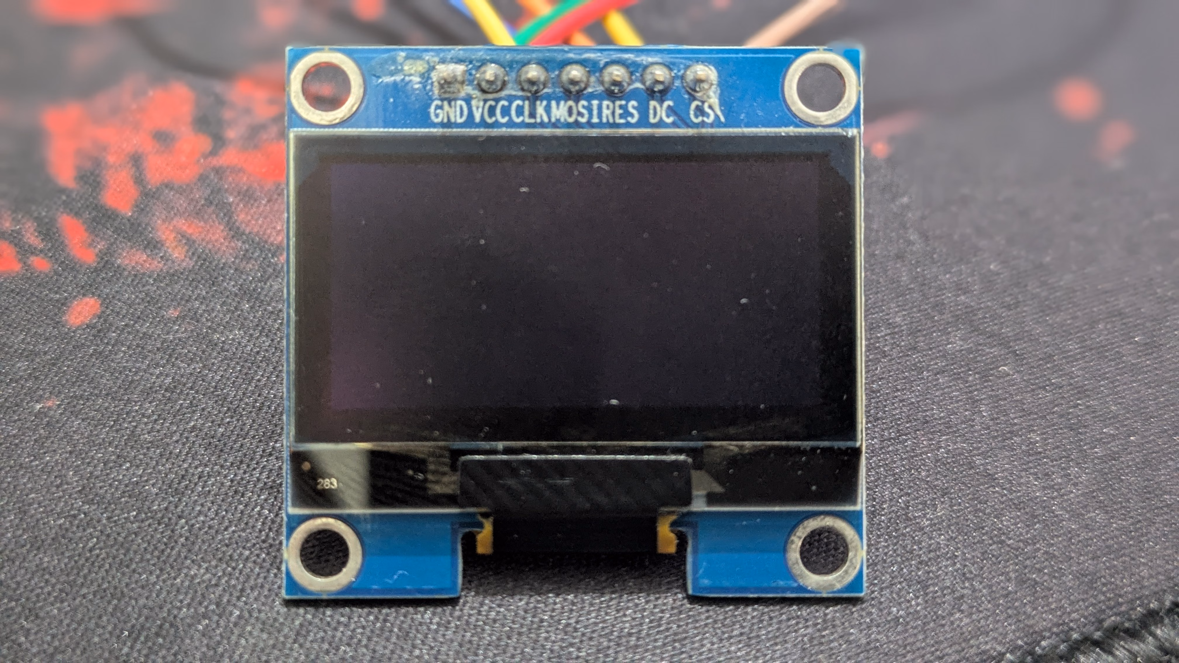 sh1106 display module on a black-gray mousepad